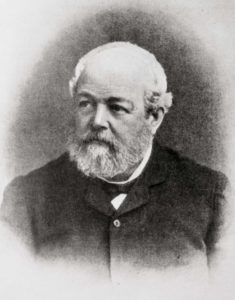 19th century portrait photograph of older man with balding head, light gray beard, and mustache