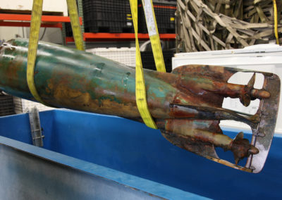 The corroded tail section of a Howell torpedo