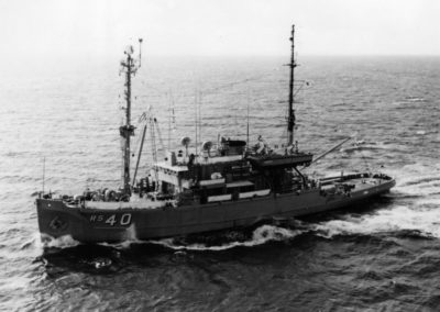Salvage ship USS Hoist sails through the water.