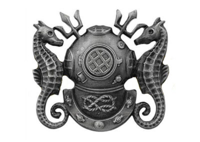 A silver Mark 5 diving helmet is flanked by two seahorses and two tridents.