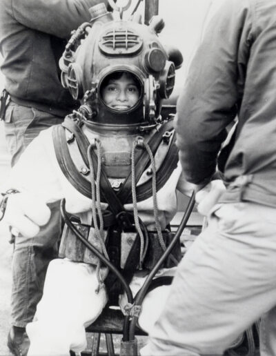 Diver Sue Trukken sits inside a 300-pound Mark 5 helium diving rig.