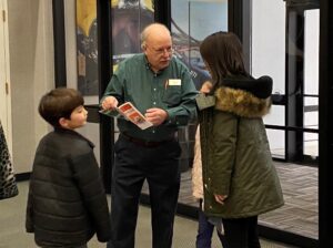 Museum Attendant welcoming visitors