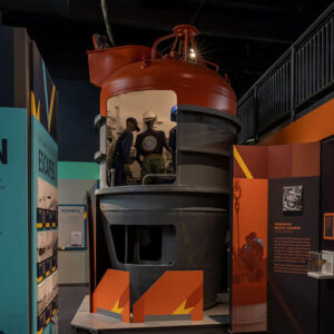 gray and red-orange submarine rescue chamber